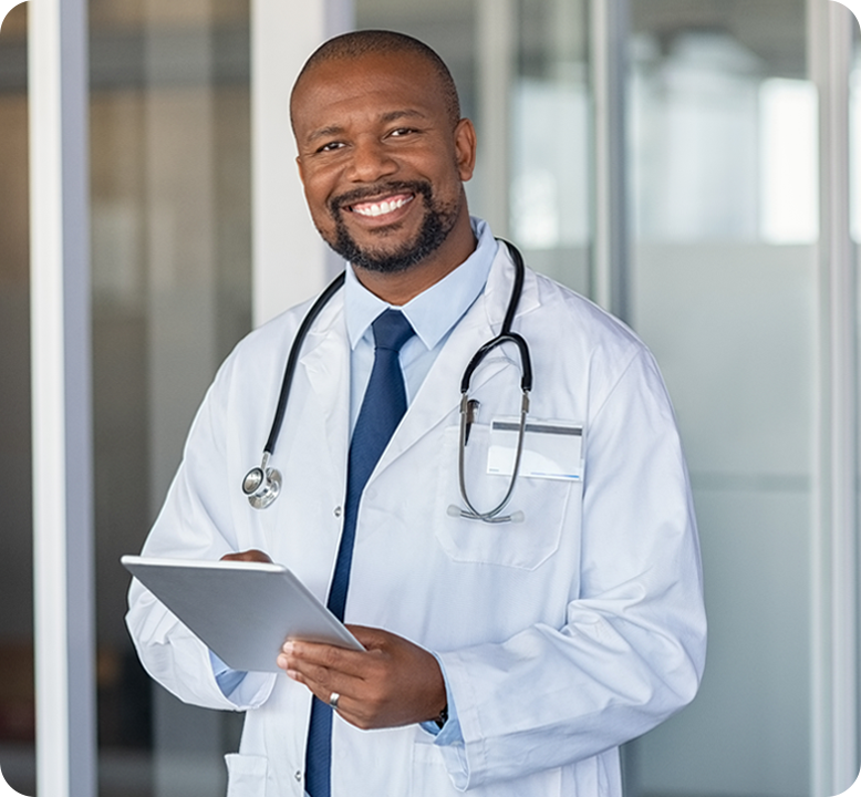 Male doctor smiling with clipboard